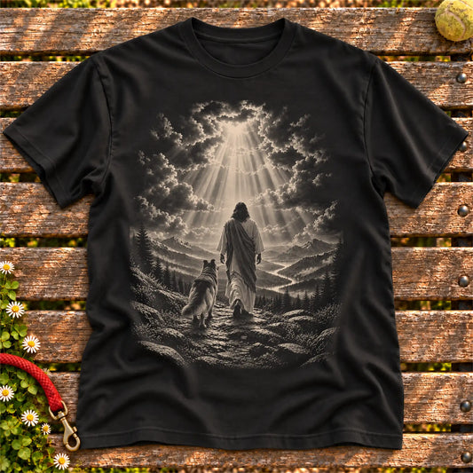 Black T-shirt showing Jesus walking beside a Collie beneath rays of light