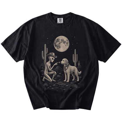 Cowboy alien fist-bumping a Labradoodle beneath the moon on a Black Comfort Colors® T-shirt