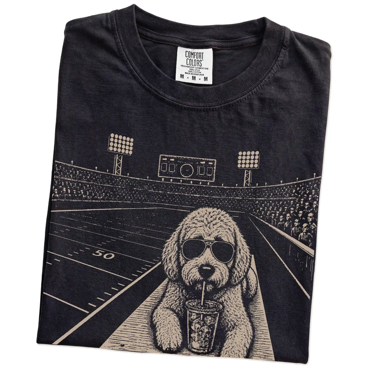 Folded Black Comfort Colors® T-shirt showing Labradoodle ready for football and tailgate season