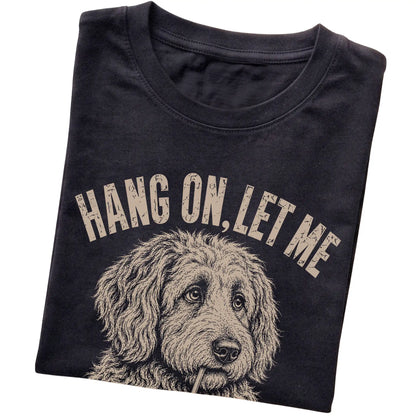 Black T-shirt featuring Overthinking Labradoodle, folded presentation