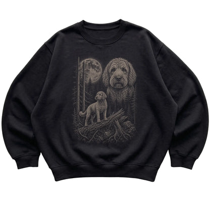 Labradoodle Moonlit Forest graphic on a black crewneck sweatshirt laid flat