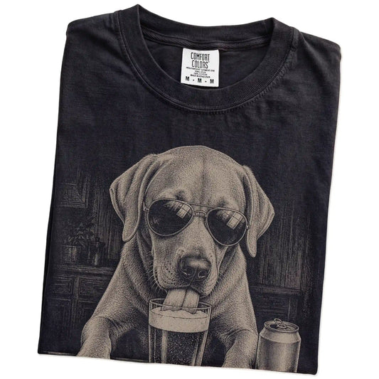 Folded Black Comfort Colors® t-shirt showing Labrador Retriever sneaking a drink from a pint