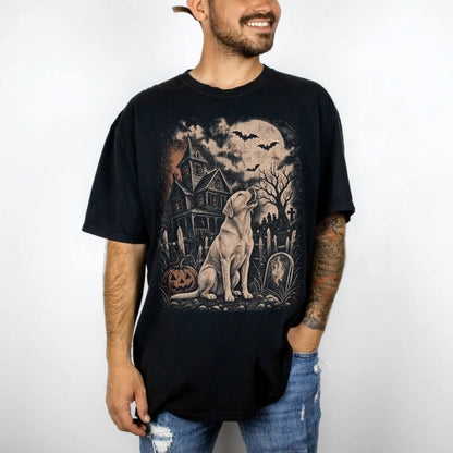 Model wearing a Black Comfort Colors® T-shirt showing Labrador Retriever in a vintage haunted-house scene