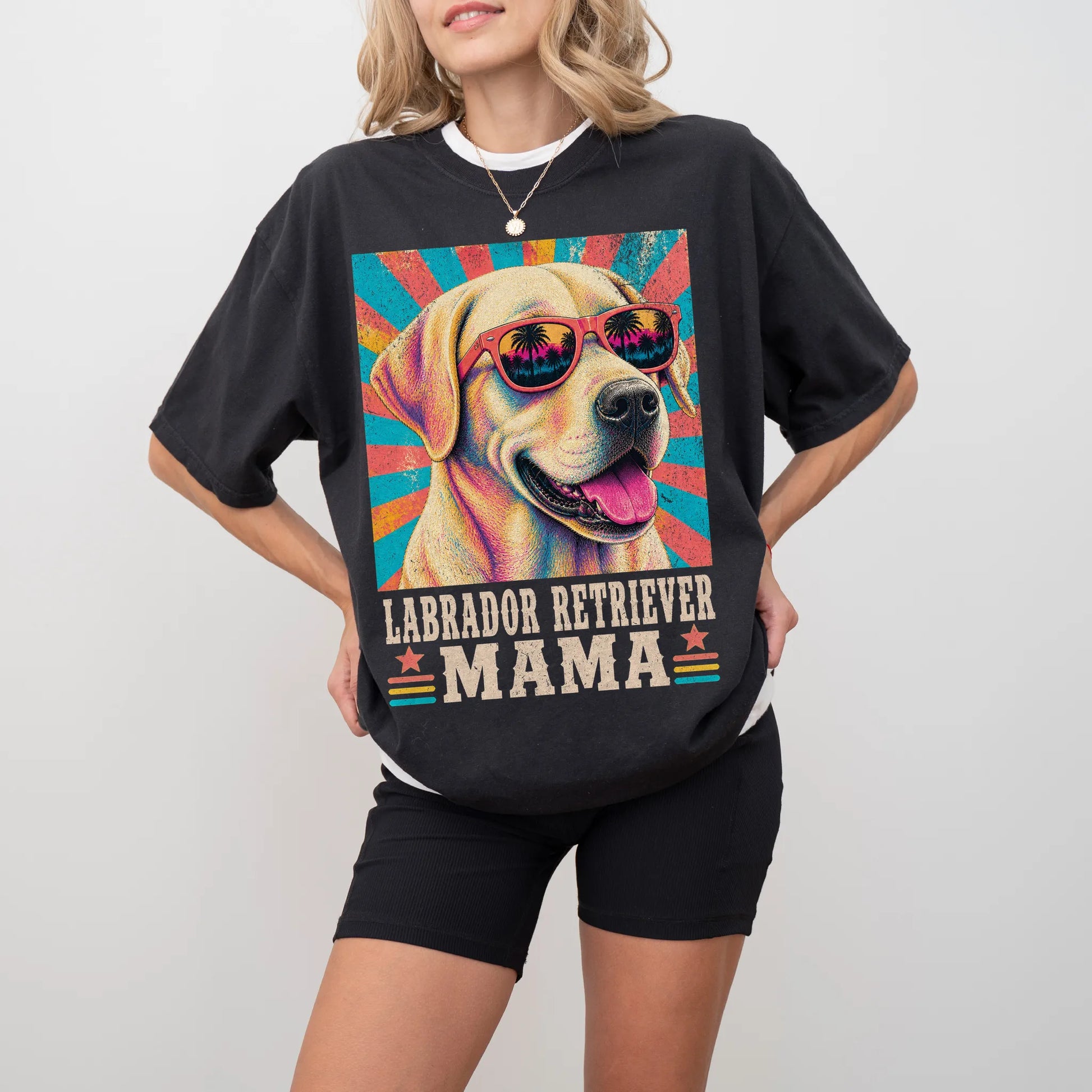 Retro Labrador Retriever Mama design on a Black Comfort Colors T-shirt worn by a model