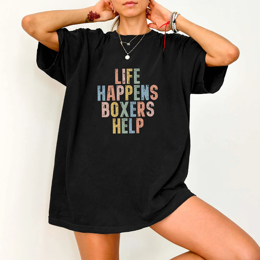 Model wearing a Black Comfort Colors® T-shirt featuring Boxer making hard days better with “Life Happens, Dogs Help” letterin