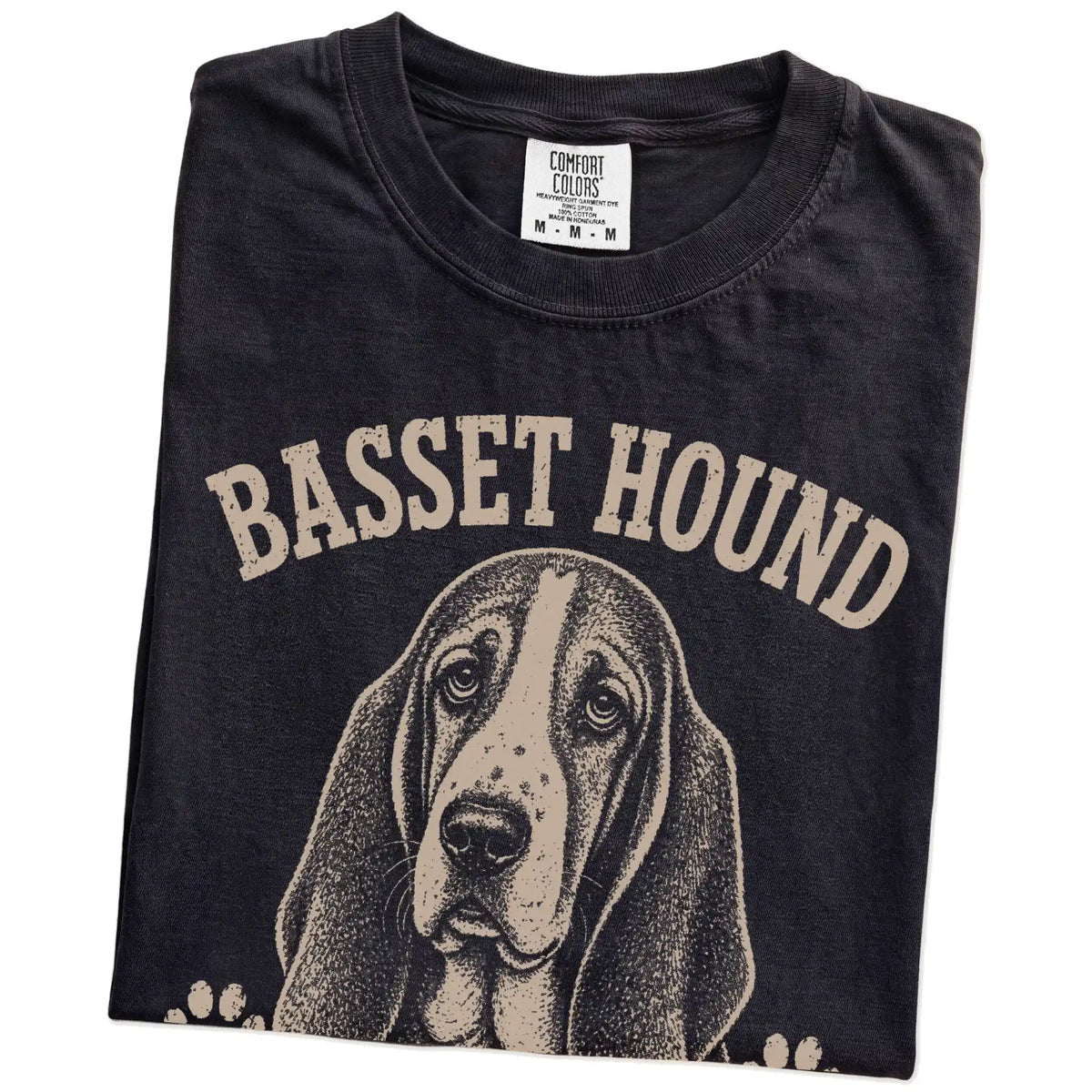 Folded Black Comfort Colors® T-shirt showing Basset Hound design with “Low Energy, High Standards” lettering
