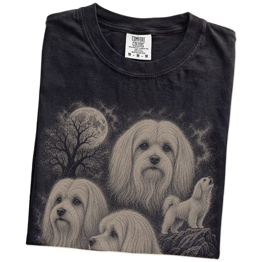 Folded Black Comfort Colors® T-shirt showing a vintage moon montage featuring Maltese