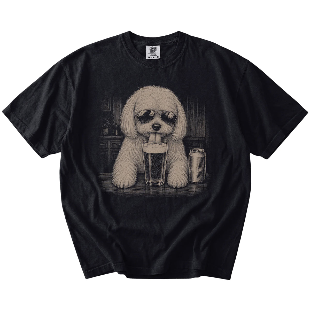Maltese sneaking a drink from a foamy pint at home on a Black Comfort Colors® t-shirt
