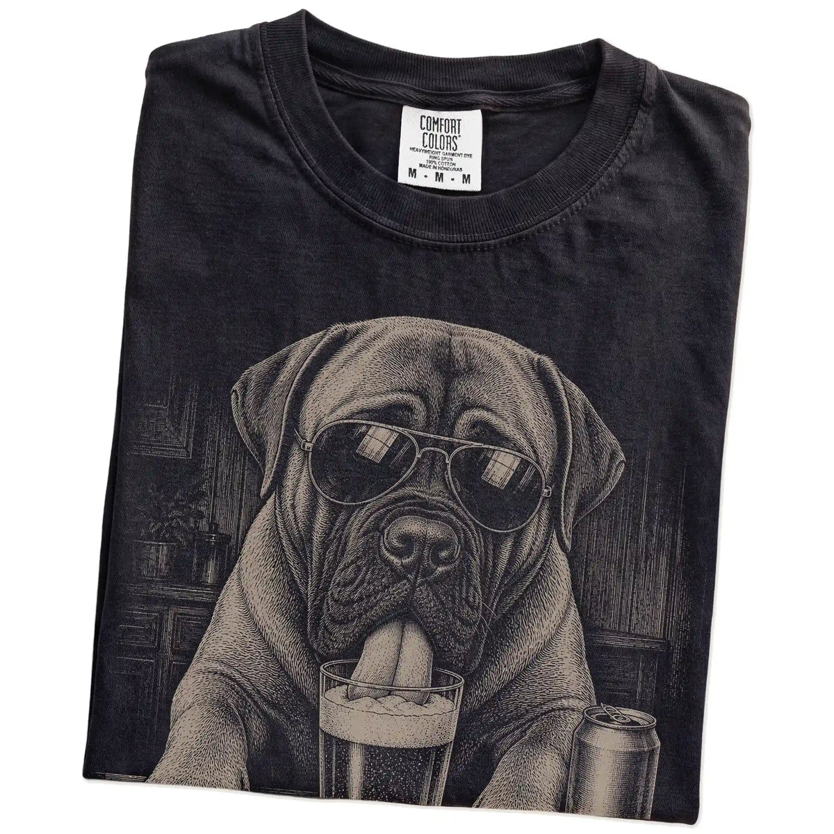 Folded Black Comfort Colors® t-shirt showing Mastiff sneaking a drink from a pint