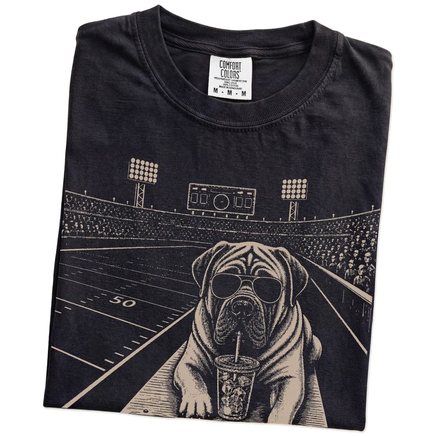 Folded Black Comfort Colors® T-shirt showing Mastiff ready for football and tailgate season