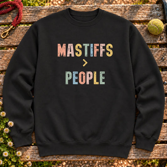 Mastiffs greater than people text design on a Black crewneck sweatshirt