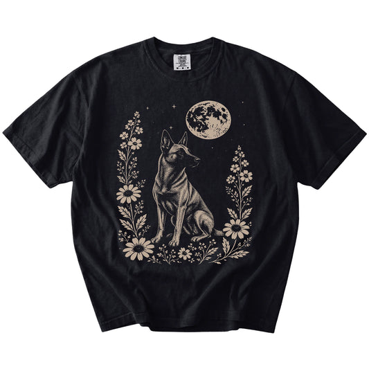 Belgian Malinois framed by flowers beneath the moon on a Black Comfort Colors® T-shirt