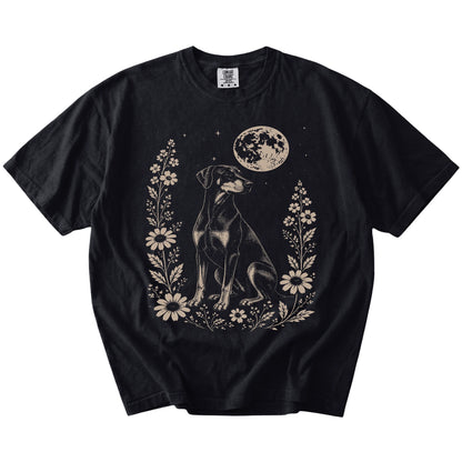 Doberman framed by flowers beneath the moon on a Black Comfort Colors® T-shirt