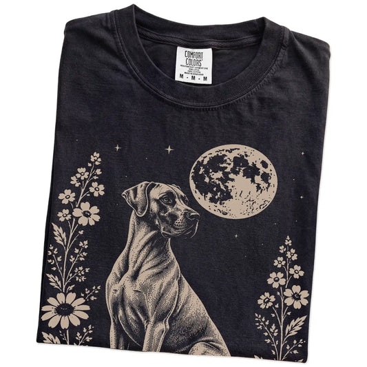 Folded Black Comfort Colors® T-shirt showing Great Dane framed by flowers beneath the moon