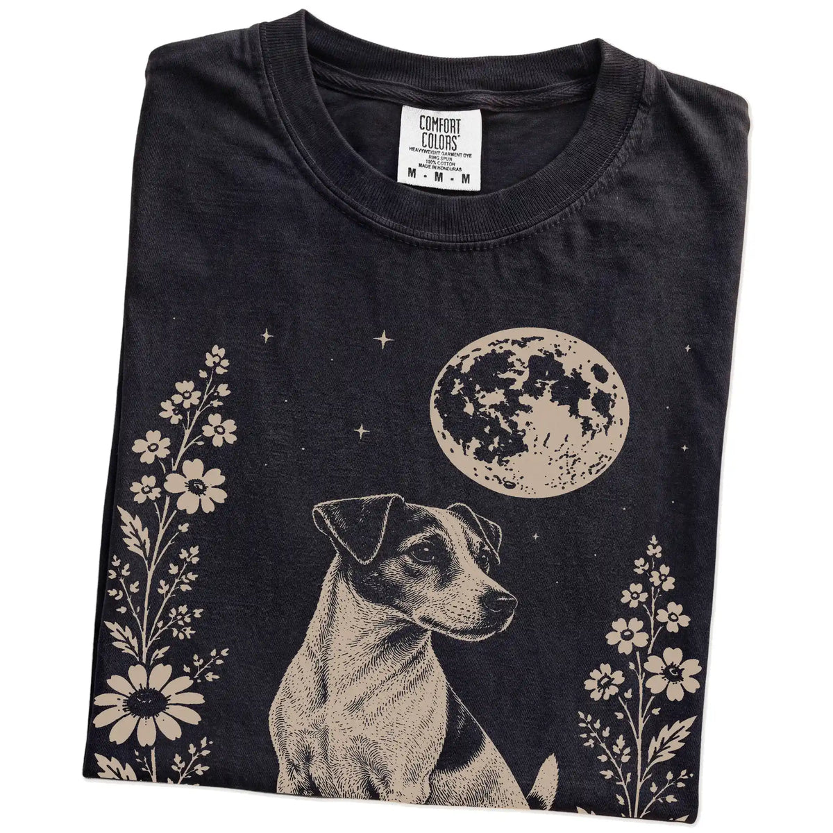 Folded Black Comfort Colors® T-shirt showing Jack Russell framed by flowers beneath the moon