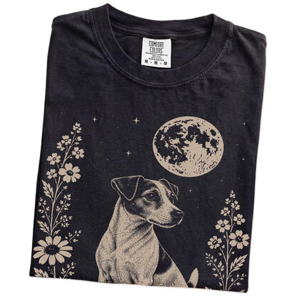 Folded Black Comfort Colors® T-shirt showing Jack Russell framed by flowers beneath the moon