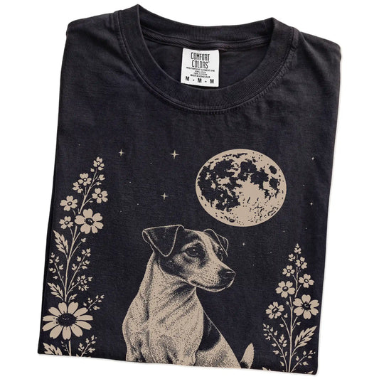 Folded Black Comfort Colors® T-shirt showing Jack Russell framed by flowers beneath the moon