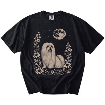 Maltese framed by flowers beneath the moon on a Black Comfort Colors® T-shirt