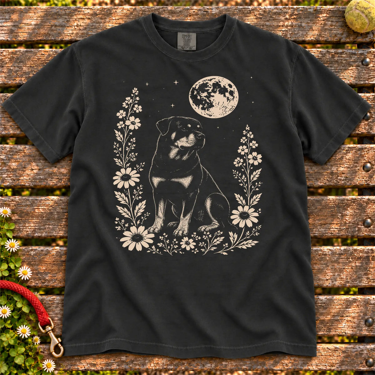 Moon Flowers Rottweiler design on a Black Comfort Colors T-shirt, shown flat