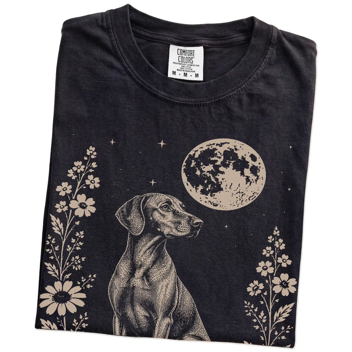 Folded Black Comfort Colors® T-shirt showing Vizsla framed by flowers beneath the moon