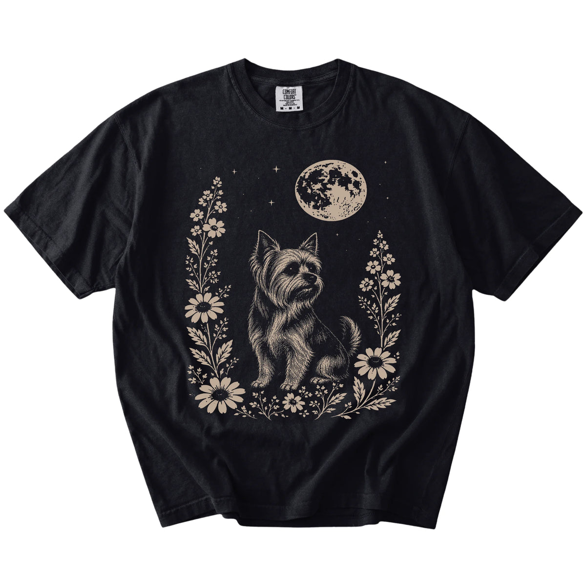Yorkie framed by flowers beneath the moon on a Black Comfort Colors® T-shirt