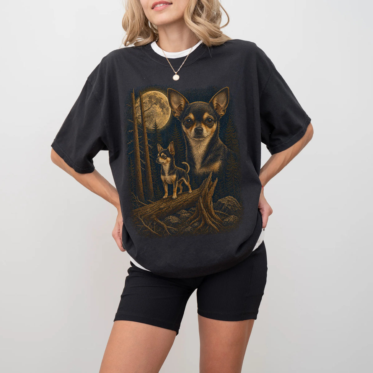 Person wearing a Black Chihuahua full-color Moonlit Forest t-shirt