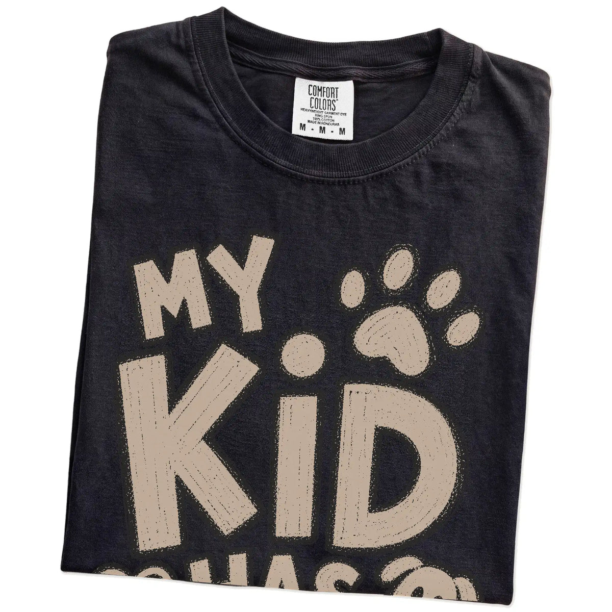 Folded Black Comfort Colors® T-shirt showing my kid has paws lettering