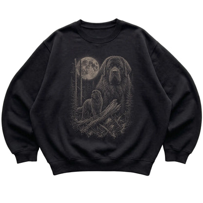 Newfie Moonlit Forest graphic on a black crewneck sweatshirt laid flat