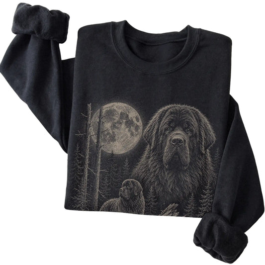 Folded black crewneck sweatshirt showing the Newfie Moonlit Forest graphic