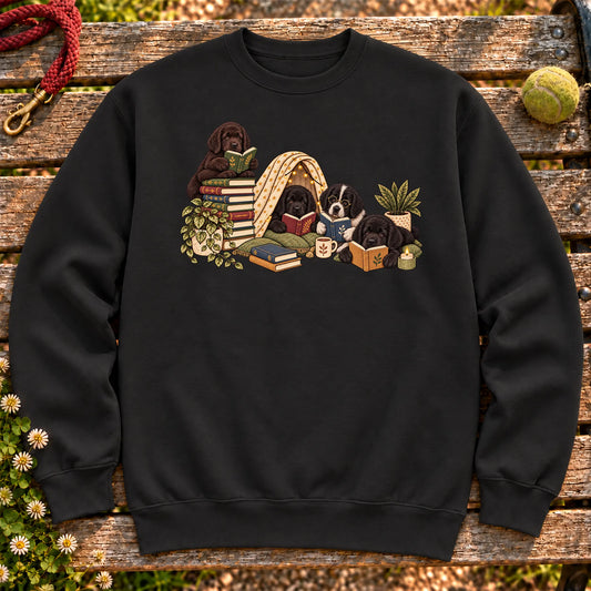 Newfie puppies reading books in a cozy blanket fort on a Black sweatshirt