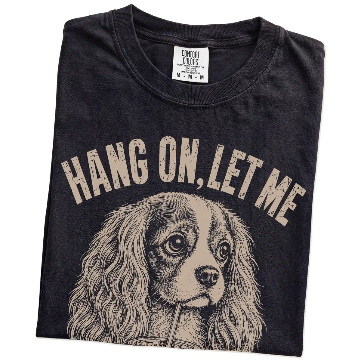 Folded Black Overthinking Cavalier King Charles Spaniel T-Shirt showing the graphic