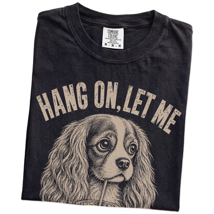 Folded Black Overthinking Cavalier King Charles Spaniel T-Shirt showing the graphic