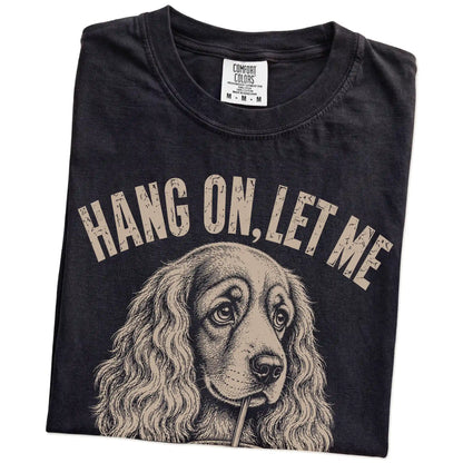 Folded Black Overthinking Cocker Spaniel T-Shirt showing the graphic