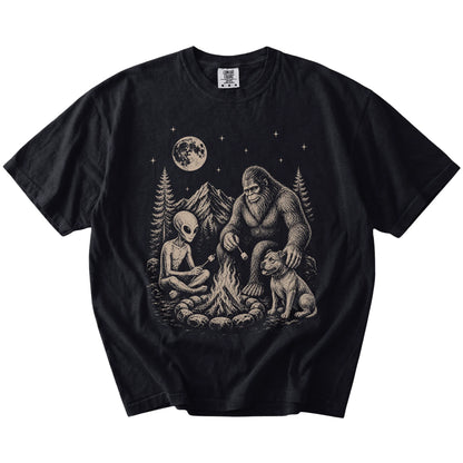 Pitbull camping with Bigfoot and an alien on a Black Comfort Colors® T-shirt
