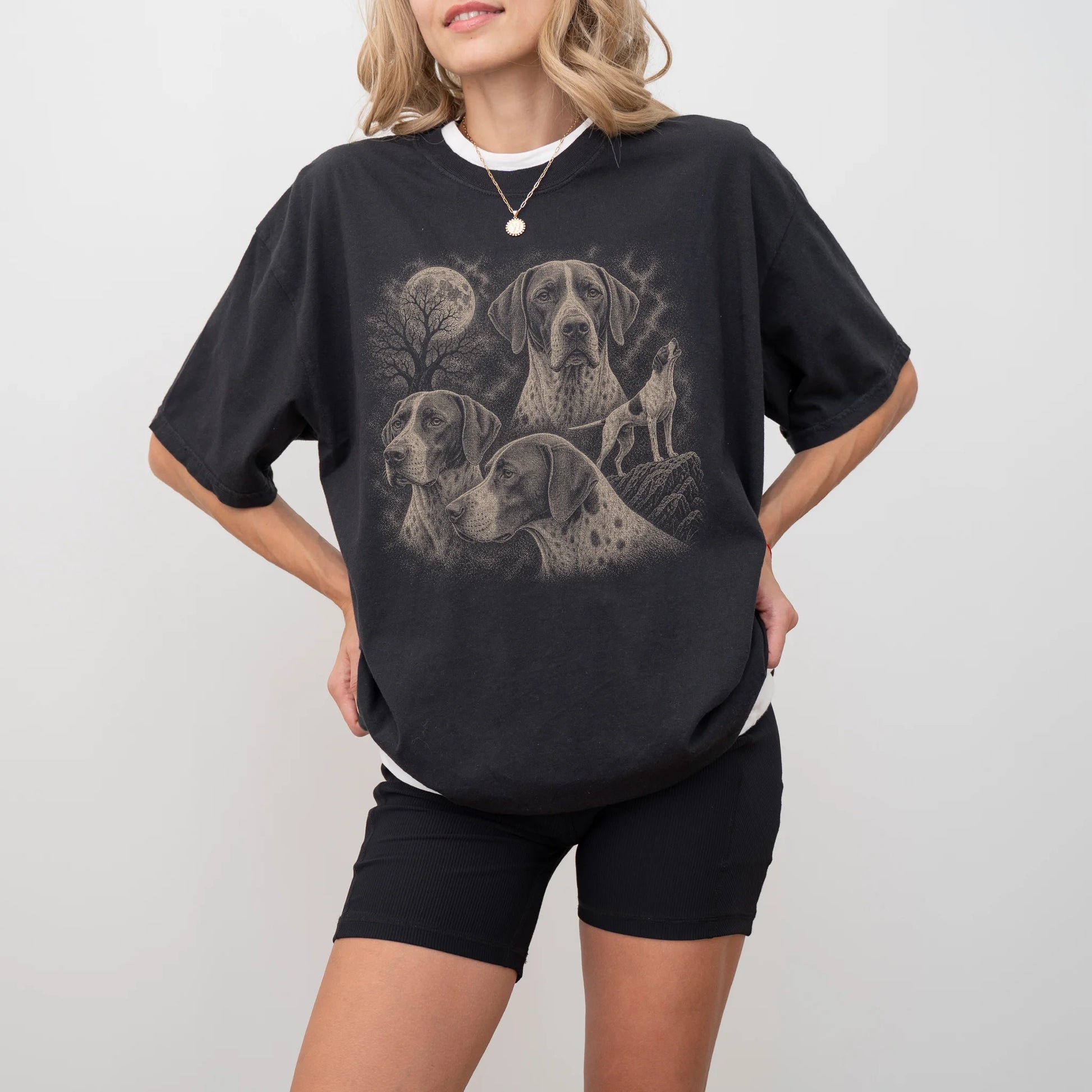 Model wearing a Black Comfort Colors® T-shirt with a vintage moon montage featuring Pointer