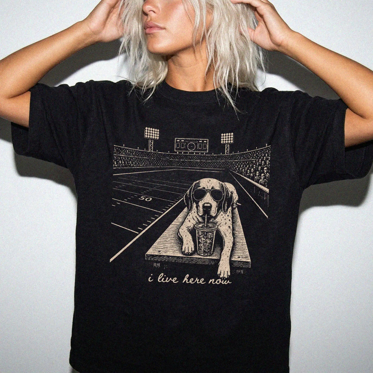 Model wearing a Black Comfort Colors® T-shirt featuring Pointer ready for football and tailgate season