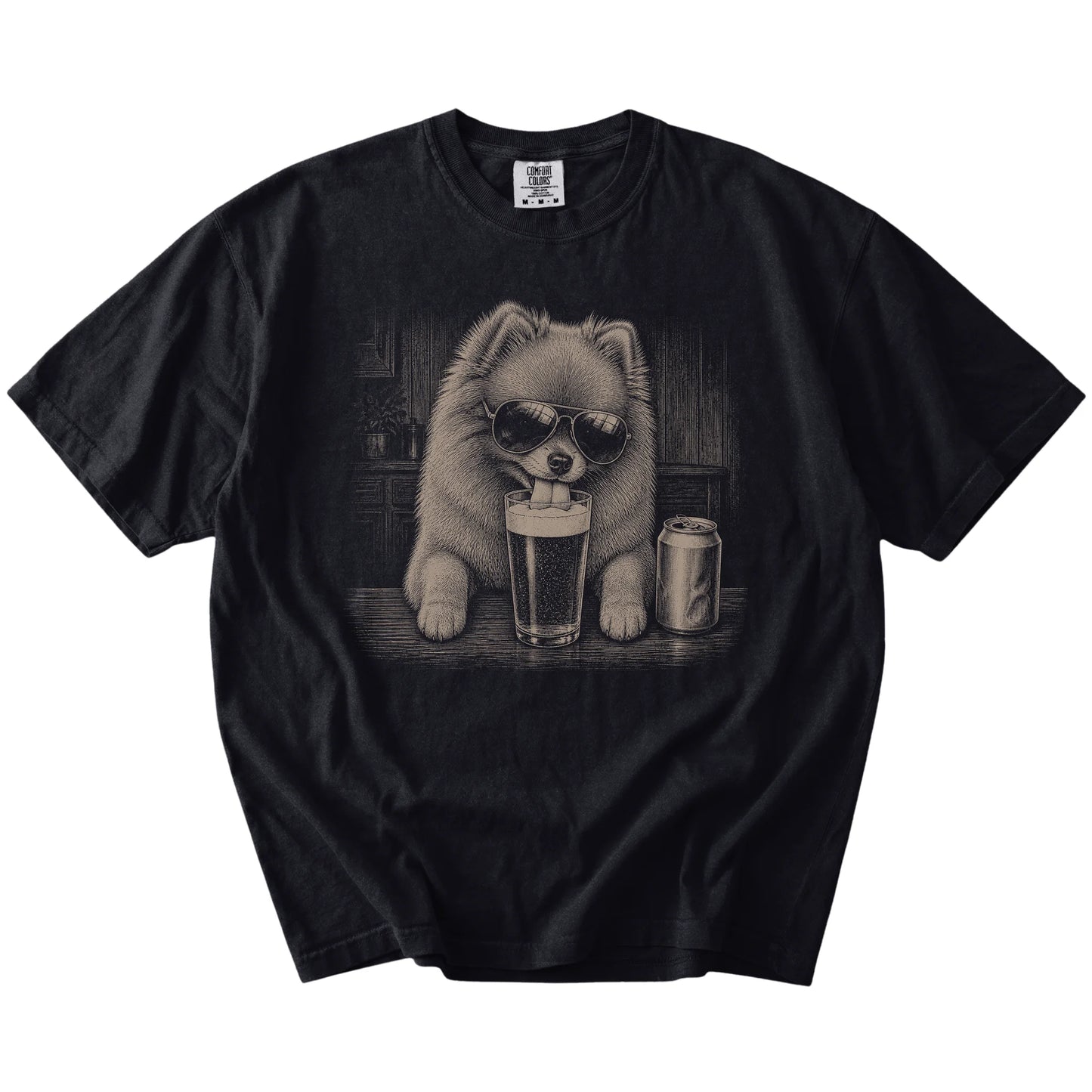 Pomeranian sneaking a drink from a foamy pint at home on a Black Comfort Colors® t-shirt