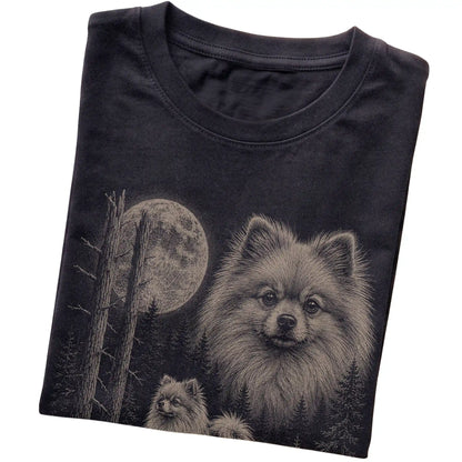 Folded black Softstyle T-shirt showing the Pomeranian Moonlit Forest graphic