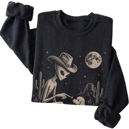 Black crewneck sweatshirt featuring Poodle Cowboy and Alien, folded presentation