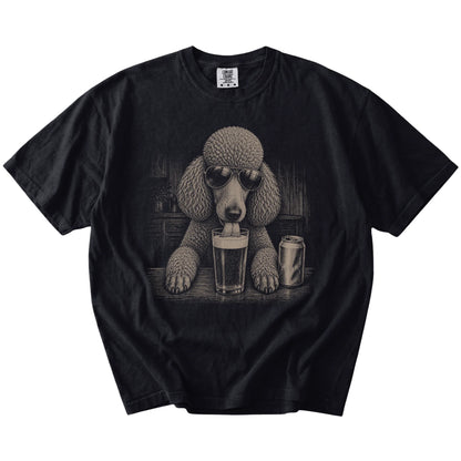 Poodle sneaking a drink from a foamy pint at home on a Black Comfort Colors® t-shirt
