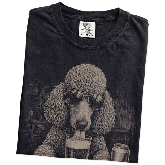 Folded Black Comfort Colors® t-shirt showing Poodle sneaking a drink from a pint