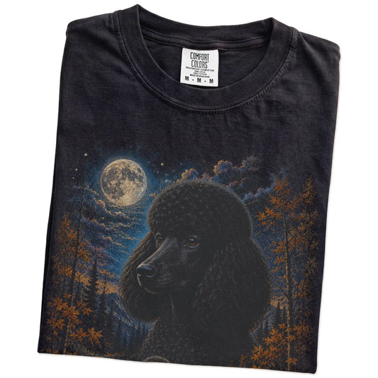 Folded Black Comfort Colors® t-shirt showing Poodle in a fall forest graphic