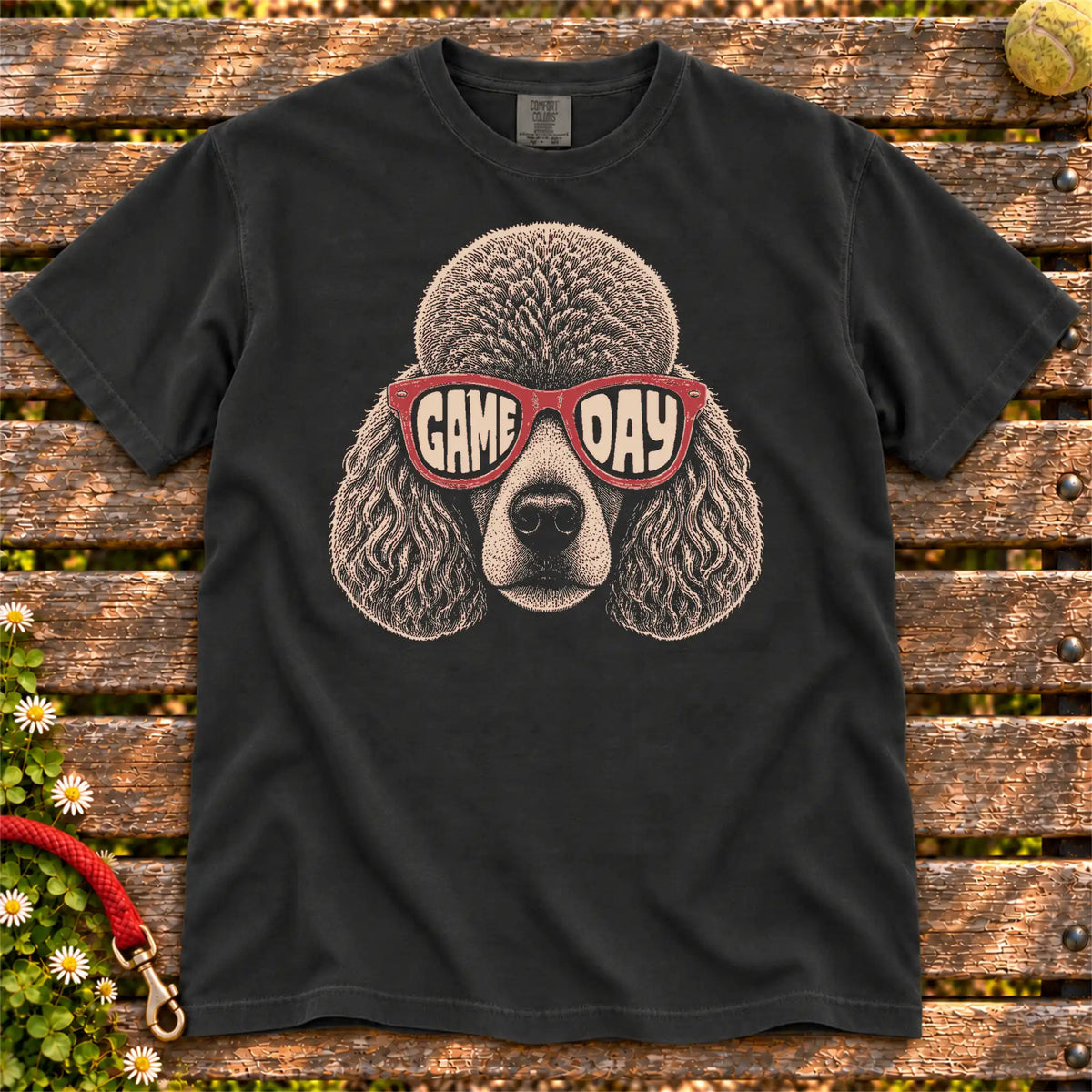 Poodle Game Day design on a Black Comfort Colors T-shirt, shown flat