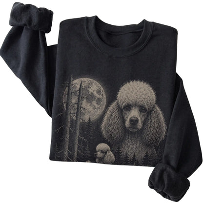 Folded black crewneck sweatshirt showing the Poodle Moonlit Forest graphic