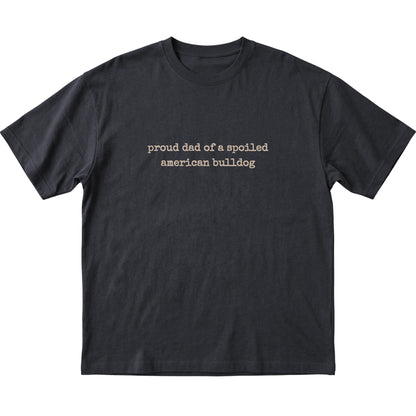 Black Proud Dad of a Spoiled American Bulldog T-shirt laid flat