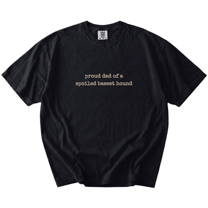 Proud Dad of a Spoiled Basset Hound lettering on a Black Comfort Colors® T-shirt