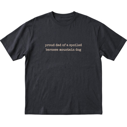 Black Proud Dad of a Spoiled Bernese Mountain Dog T-shirt laid flat