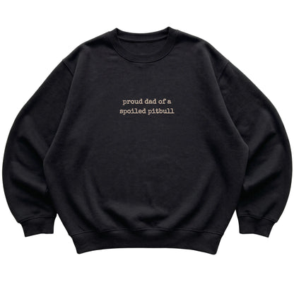 Black Proud Dad of a Spoiled Pitbull sweatshirt laid flat