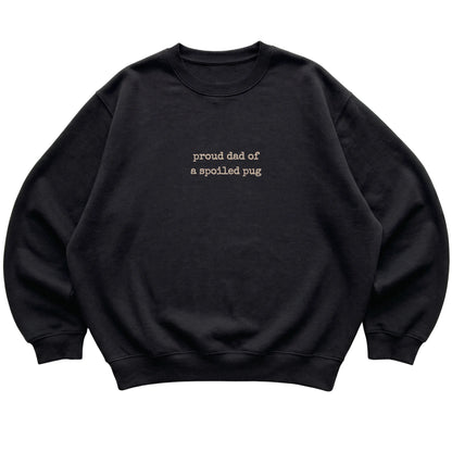 Black Proud Dad of a Spoiled Pug sweatshirt laid flat