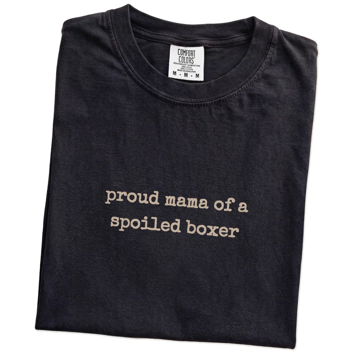 Folded Black Comfort Colors® T-shirt showing Proud Mama of a Spoiled Boxer lettering